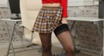 Only Tease Luna in a plaid miniskirt and black stockings