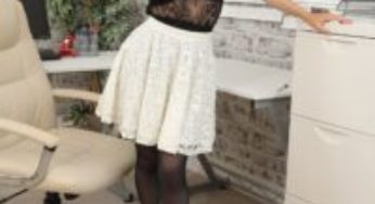 Layered-Nylons Suzi in a white skirt with black pantyhose over her stockings