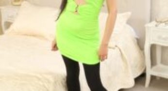 Only Tease Louisa Lu in a bright minidress with black opaque tights